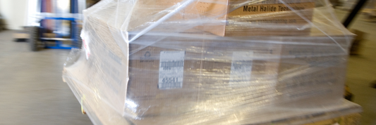 Choosing the Right Packaging: Heat Shrink vs. Stretch Wrap for Pallets